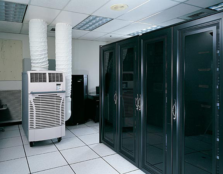 MovinCool Office Pro 60 portable spot cooler used in a server room